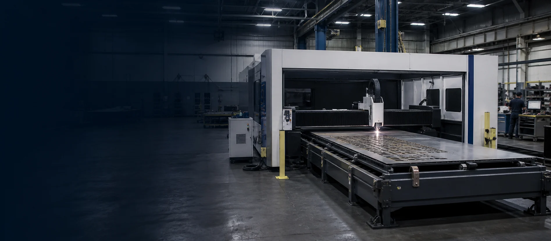 Fiber laser cutting machine operating in a metal fabrication workshop